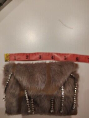 Faux Fur Chain-Embellished Clutch in Taupe